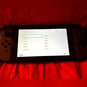 Original Nintendo Switch, grey and black version, with bundle.